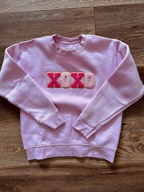 Wink Pink Crewneck Sweater with Gold-Edged XOXO Appliqué